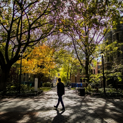 photo of man walking on Penn campus